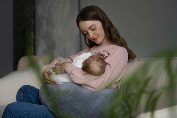 woman-using-nursing-pillow-home-newborn-baby (1)